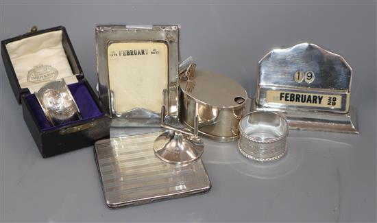 A silver-mounted desk calendar, a similar easel calendar with ivory day/date plaques and five other items,